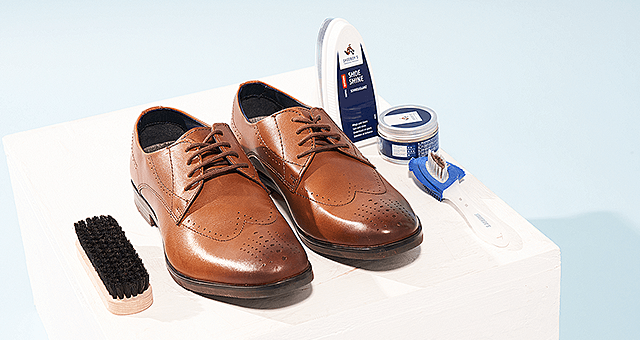 Shoeboy's shoe cleaning products next to men's smart shoes